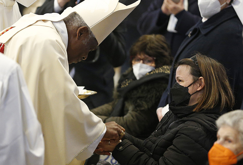 Cardinal Peter Turkson, former prefect of the Dicastery for Promoting Integral Human Development, anointed the hands of a woman as he celebrated Mass marking World Day of the Sick in St. Peter’s Basilica at the Vatican Feb. 11.