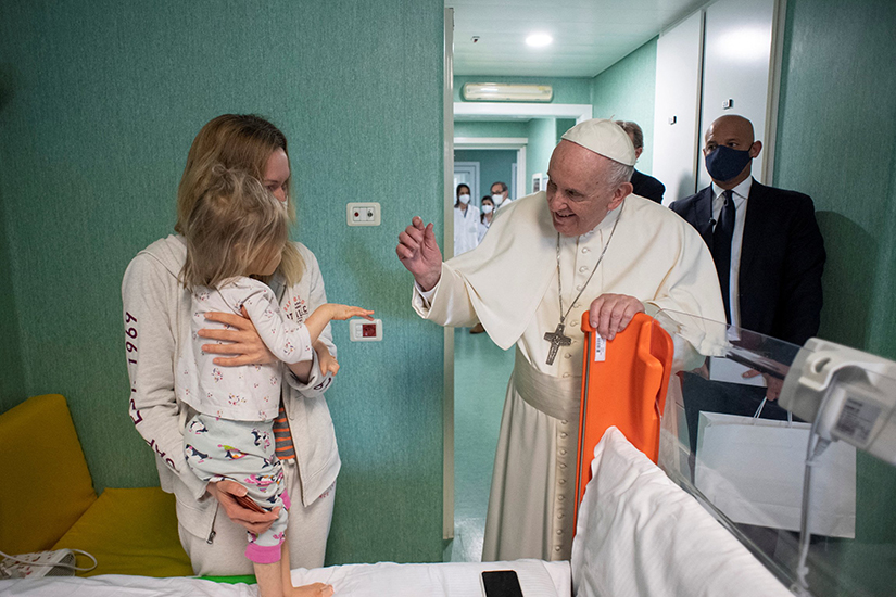 Pope Francis greeted a child as he visited Ukrainian children being treated at the Vatican-owned Bambino Gesu Children’s Hospital in Rome March 19. The next day, Pope Francis told pilgrims gathered for the Angelus prayer that among the patients there was a child who is missing an arm and another with a head wound as a result of the Russian bombing of Ukraine.