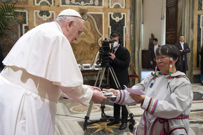 Pope Francis received a gift from Rhoda Ungalaq, a representative of Canada's Inuit, during a meeting with members of three Canadian Indigenous groups in the Vatican's Clementine Hall April 1.