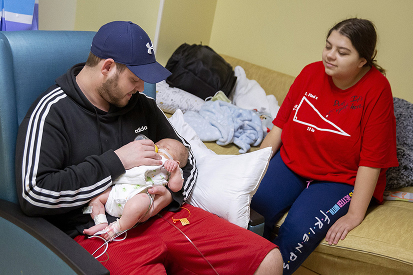 Noah Hallihan fed a bottle to his son, Braylen, in the neonatal intensive care unit (NICU) with Braylen’s mother, Makinzie Spease, in March at SSM Health Cardinal Glennon Children’s Hospital.