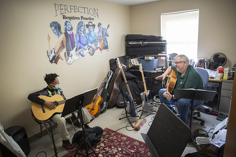 Alex Kelley, 12, met with Donald Wright for a guitar lesson April 27 at Presentation Arts Center at Our Lady of the Presentation Parish in Overland. The center got its start in 2016 and is a community outreach ministry of the parish.