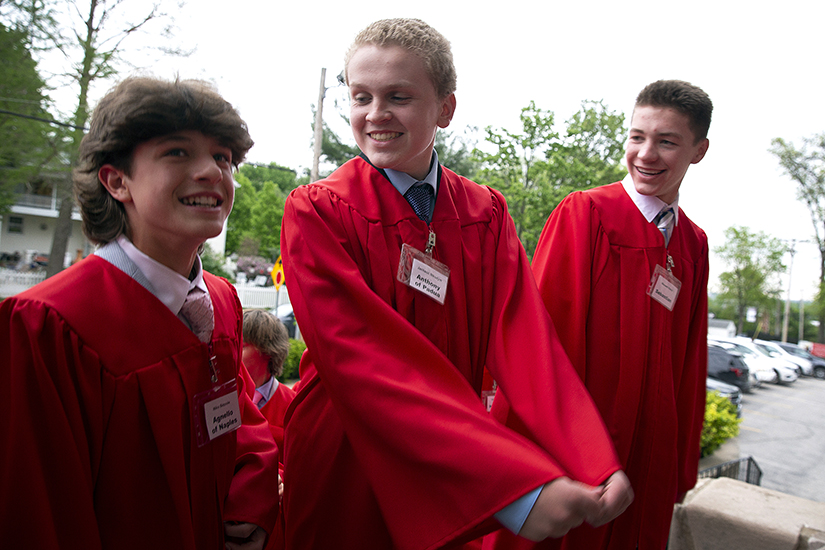 Niko Bezzole, Jackson Nikodym and Maxwell Kelch walked into church before their confirmation May 4 at St. Charles Borromeo Church in St. Charles. Confirmation is often referred to as the “sacrament of maturity,” as it completes the process of initiation into the Christian community.
