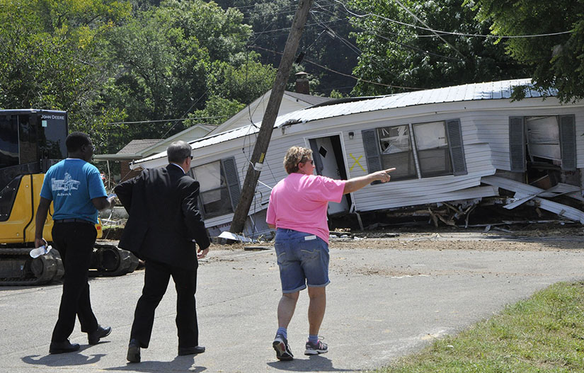 Bishop J. Mark Spalding of Nashville, Tenn., visited with flood victims in Waverly, Tenn., Aug. 24, 2021. On his visit, he prayed with them and brought the message “You’re not alone.”