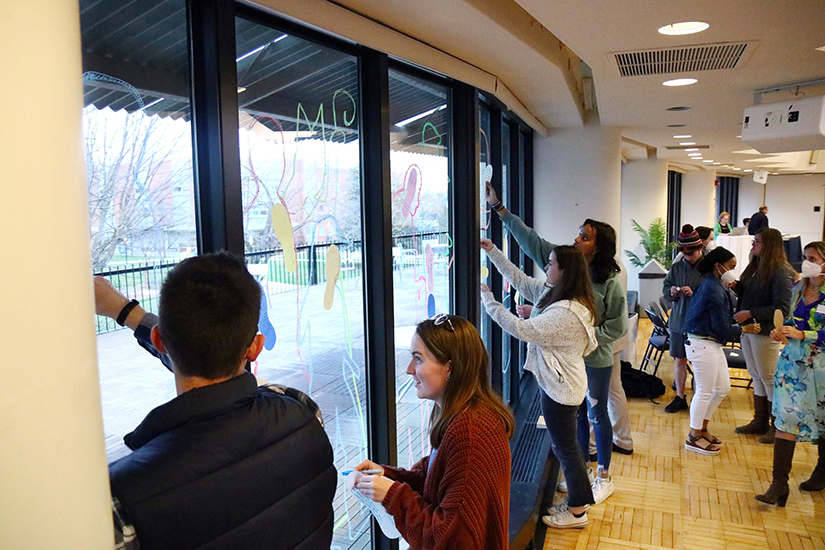 Participants in a synod listening session at La Salle University in Philadelphia wrote messages about the experience April 4 and attached them to the windows of a conference room for passersby to read.
