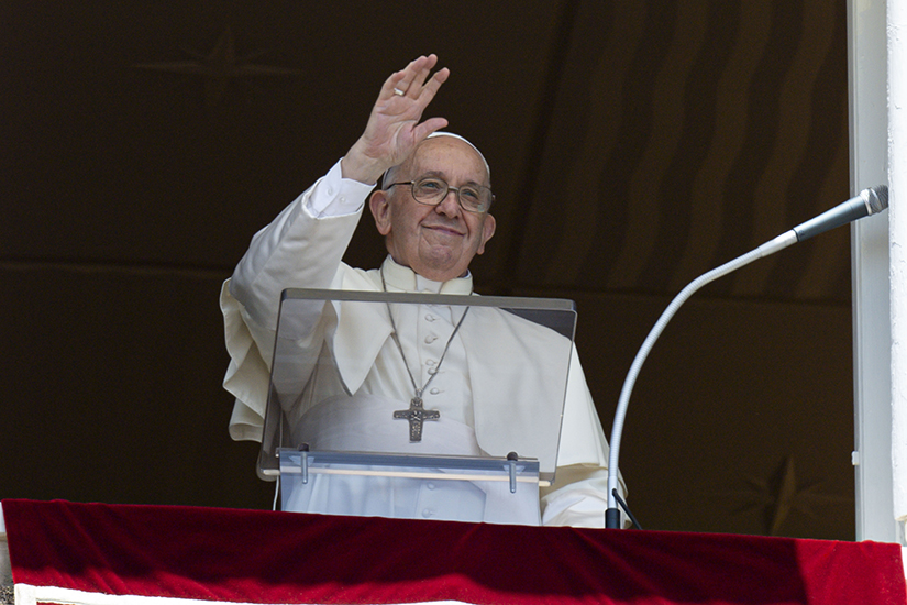 Pope Francis greeted the crowd as he led the "Regina Coeli" from the window of his studio overlooking St. Peter's Square at the Vatican May 22.
