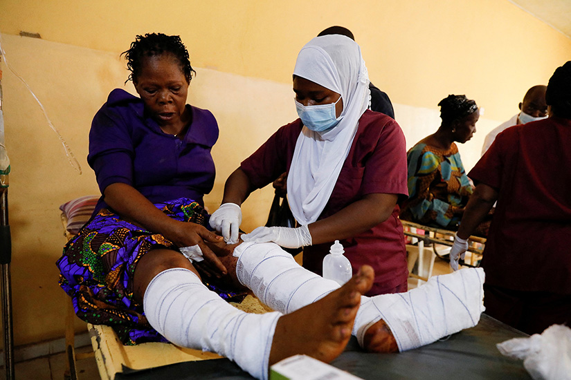 A nurse at the Federal Medical Centre in Owo, Nigeria, attended one of the victims of the attack by gunmen during Pentecost Mass at St. Francis Xavier Church in Owo June 6. Reports said at least 50 people were killed in the attack.