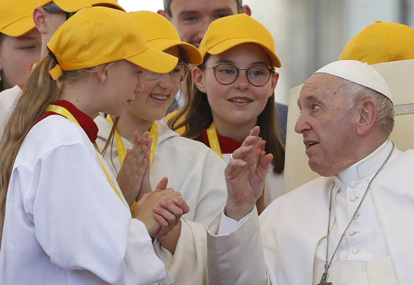 Pope Francis talked with children during his general audience in St. Peter’s Square at the Vatican June 8.