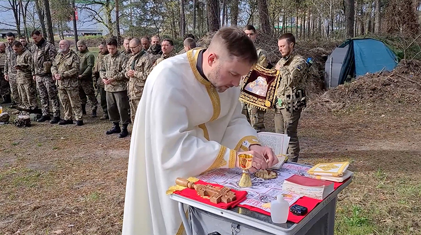 Father Rostyslav Vysochan, a military chaplain, celebrated a Divine Liturgy with soldiers in an undisclosed location in Ukraine in June 2022.
