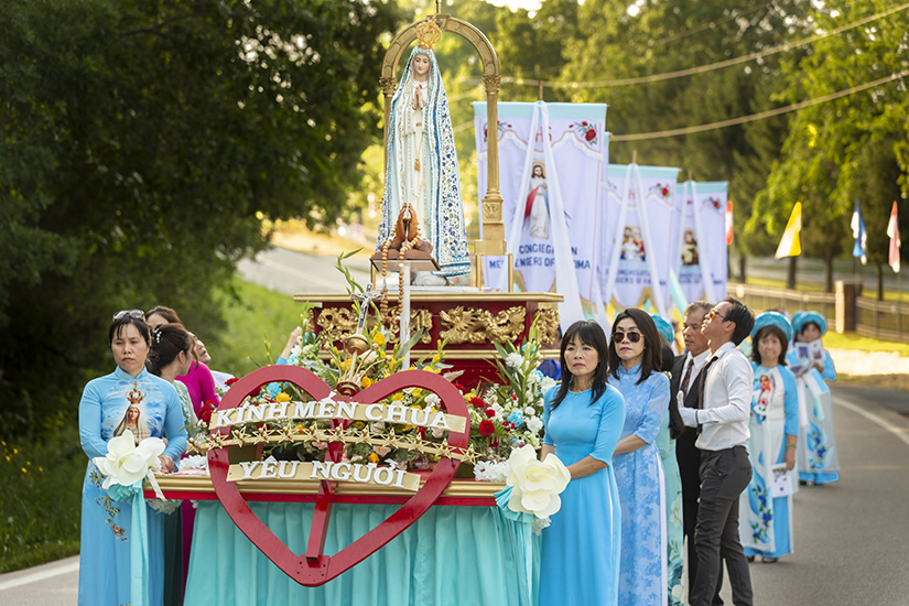 Participants walked in a procession along Highway WW in St. Clair with a statue Our Lady of Fatima during the Fatima Days celebration hosted by the Congregation Messengers of Fatima on June 25.