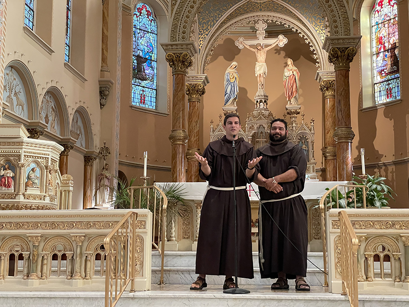 Franciscan Fathers Casey Cole, left, and Roberto “Tito” Serrano gave several short talks on “What the World Needs” June 28 at St. Anthony of Padua Church in St. Louis. The Franciscan Friars, who have dubbed themselves the “Bleacher Brothers,” are making a cross-country trip to visit every Major League Baseball stadium to evangelize, meeting people where they are and inviting them to the Church.