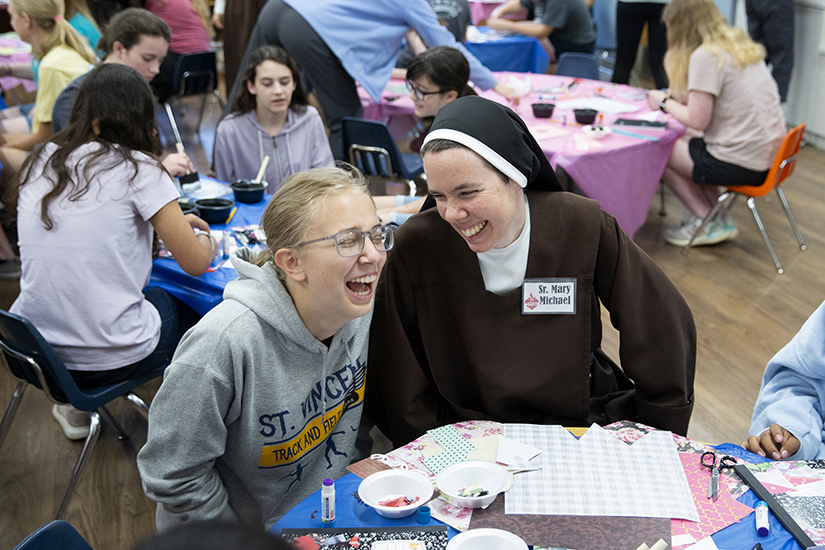 Sister Mary Michael laughed with her niece Lydia Clements during Carmelite Day on May 21 at the Carmelite Child Development Center in Kirkwood. As the vocation directress for the Carmelite Sisters of the Divine Heart of Jesus, Sister Mary Michael assists young women as they are discerning religious life with the Carmelites.