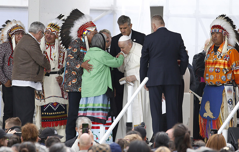 Pope Francis kissed the hand of a woman during a meeting with First Nations, Métis and Inuit communities at Maskwacis, Alberta, July 25.