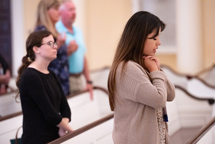 Blanca Rodriquez, right, from the Archdiocese of Chicago, prayed during Mass celebrated by Archbishop William E. Lori July 18 at the Basilica of the National Shrine of the Assumption of the Blessed Virgin Mary. The Mass was part of the U.S. Conference of Catholic Bishops’ 2022 Diocesan Pro-Life Leadership Conference in Baltimore.
