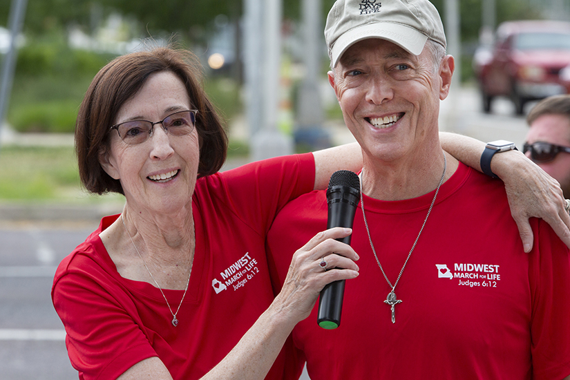 Linda and Chuck Raymond, parishioners at Holy Infant in Ballwin, spoke during a gathering outside Planned Parenthood in St. Louis on June 24. Earlier in the day, the U.S. Supreme Court released its decision in Dobbs v. Jackson Women's Health Organization.