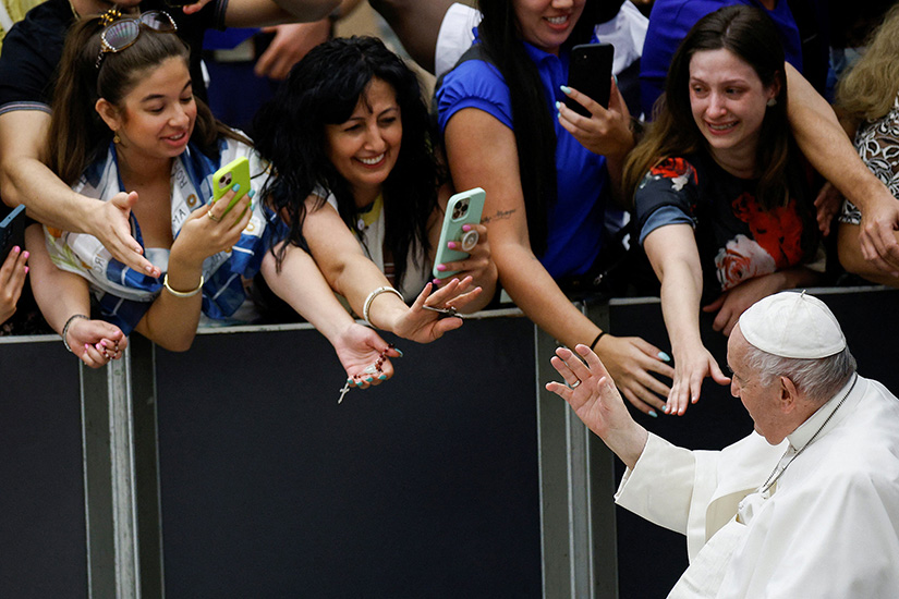 Pope Francis greeted people during the weekly general audience Aug. 24 at the Vatican. In his catechetical talk, the pope finished a series of talks on old age and called on all Christians to “hope for this fullness of life that awaits us all” in heaven.