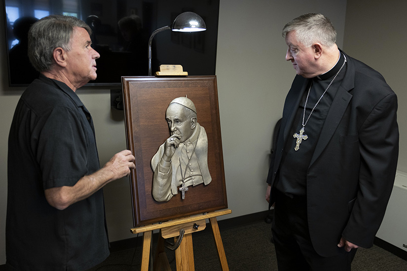 Sculptor Don Wiegand, left, and Archbishop Mitchell T. Rozanski talked about Wiegand’s sculpture of Pope Francis on Aug. 1 at the Cardinal Rigali Center in Shrewsbury.