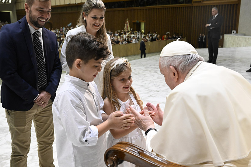 Pope Francis greeted children during his general audience in the Paul VI hall at the Vatican Aug. 31.