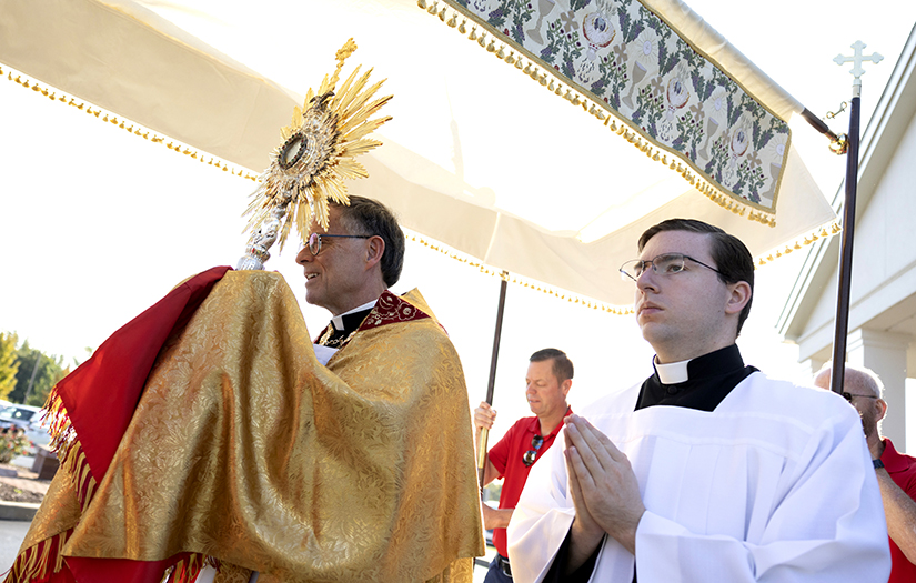 Father Timothy P. Elliott carried the Blessed Sacrament next to Kenrick-Glennon seminarian John Grim during a eucharistic procession Sept. 17 at St. Gianna Church in Wentzville.
