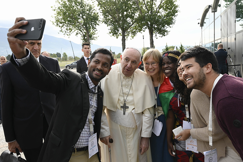 Pope Francis posed for a selfie during a meeting in Assisi, Italy, Sept. 24. The pope led a meeting with young economists, entrepreneurs, financial advisers, scholars and scientists who have been working for two years on the Economy of Francesco project. 