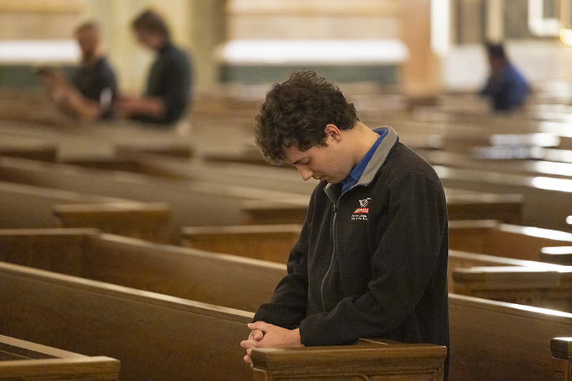 Joey Musial, a parishioner at St. Mary Magdalen in Brentwood, prayed before making the sacrament of reconciliation at an Anima Christi young adult event Oct. 13 at the Cathedral Basilica of Saint Louis. The event included confession, eucharistic adoration, dinner and fellowship. When he previously returned to the sacrament of confession after time away from the Church, “It felt like a weight was gone that I didn’t even know was there before. It was like taking off a heavy backpack at the end of the day,” he said.