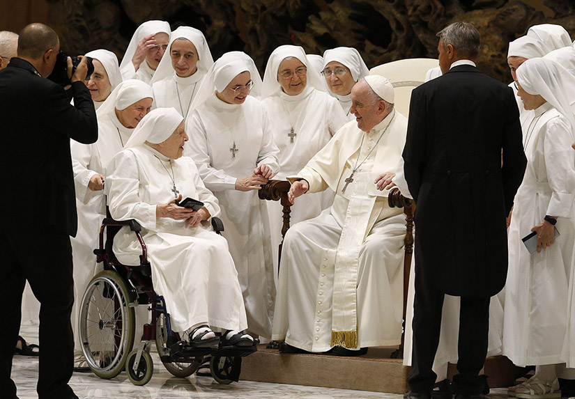 Pope Francis greeted nuns during his general audience in the Paul VI hall at the Vatican Aug. 17.