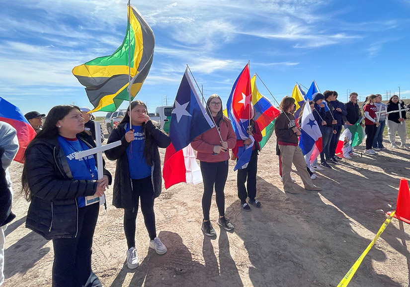 Students from the Archdiocese of St. Louis and the Diocese of El Paso held flags and crosses representing mourning for the lives of migrants who have died crossing the border. The students participated in the annual Mass at the Border, which gathers pilgrims and residents of the border cities of El Paso, Las Cruces, New Mexico, and Ciudad Juárez, Mexico.