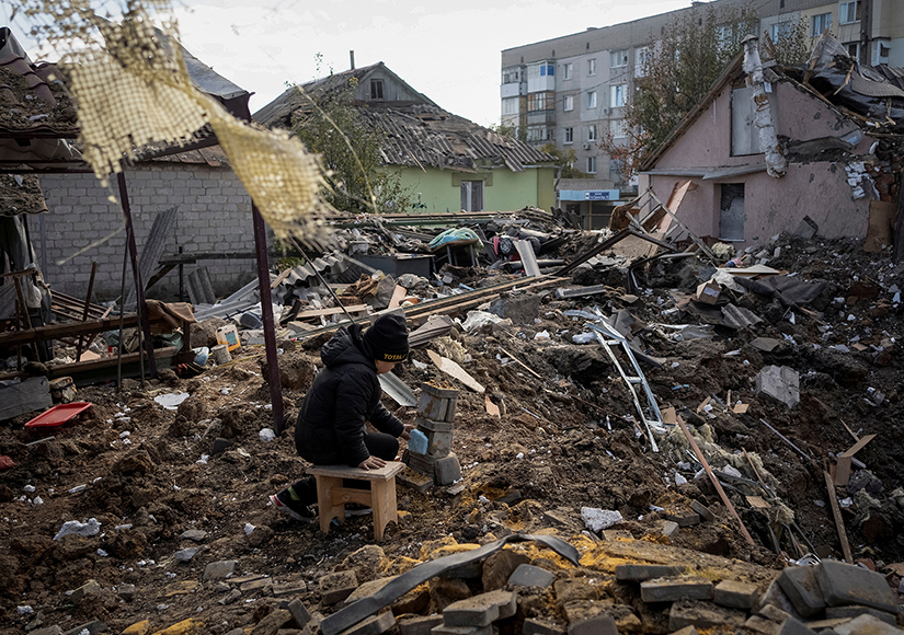 A boy played on the ruins of his grandmother’s house in Kupiansk, Ukraine, in October amid Russia’s attack on Ukraine.