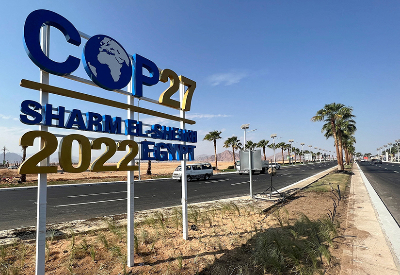 The COP27 sign is displayed along a road leading to the conference area in Egypt’s Red Sea resort of Sharm el-Sheikh as the city was the host for the COP27 summit Nov. 6-18.
