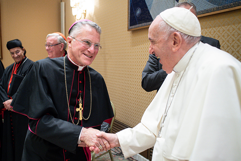 Pope Francis greeted Archbishop Timothy P. Broglio, president of the U.S. Conference of Catholic Bishops, during a meeting with the presidents and coordinators of the regional assemblies of the Synod of Bishops at the Vatican Nov. 28.