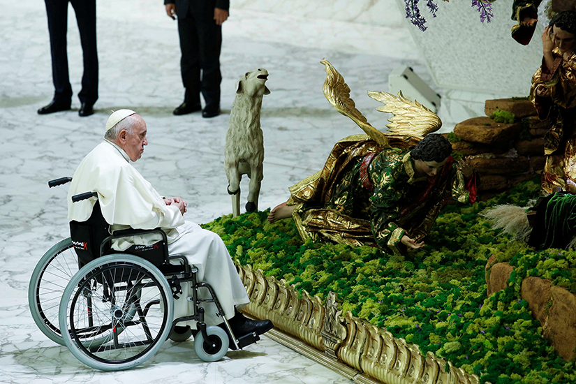 Pope Francis visited a Nativity scene during an audience with the donors of the Vatican Christmas tree and the Nativity scenes in the Paul VI hall at the Vatican Dec. 3.