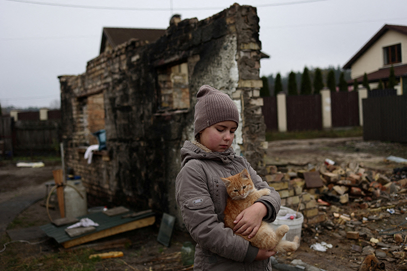 Yuliia Zaika, a 9-year old Ukrainian girl, held her cat in the village of Moshchun near Kyiv, Ukraine, in November.
