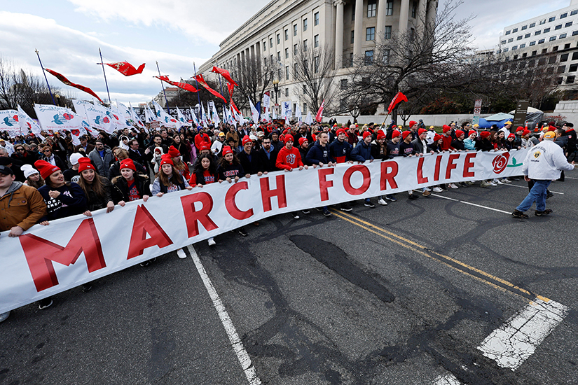 Pro-life demonstrators carried a banner past the U.S. Supreme Court during the annual March for Life in Washington Jan. 20. This year's march was since the high court overturned its 1973 Roe v. Wade abortion decision June 24, 2022. 