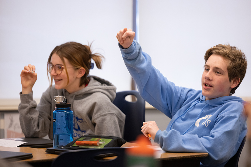 Eighth-graders Sean Bushlack, right, and Harper Searcy practiced making letters in American Sign Language Jan. 24 at St. Margaret of Scotland School in St. Louis. Sean and his siblings receive scholarships from the Today and Tomorrow Educational Foundation.