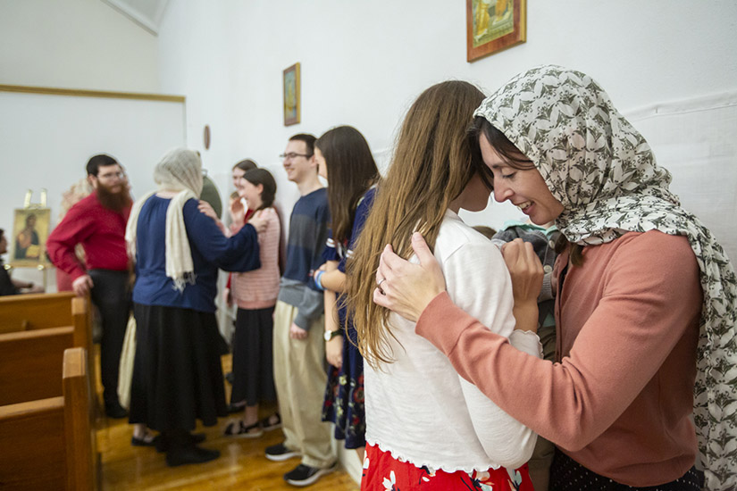 Ellie Dunaway, left, and her mother, Rachel Dunaway, asked for and granted each other forgiveness Feb. 19 during Forgiveness Vespers at St. Louis Byzantine Catholic Church. Forgiveness Vespers kicks off the penitential season in the Byzantine Catholic Church by focusing on the universal need for forgiveness from the Lord and from each other.