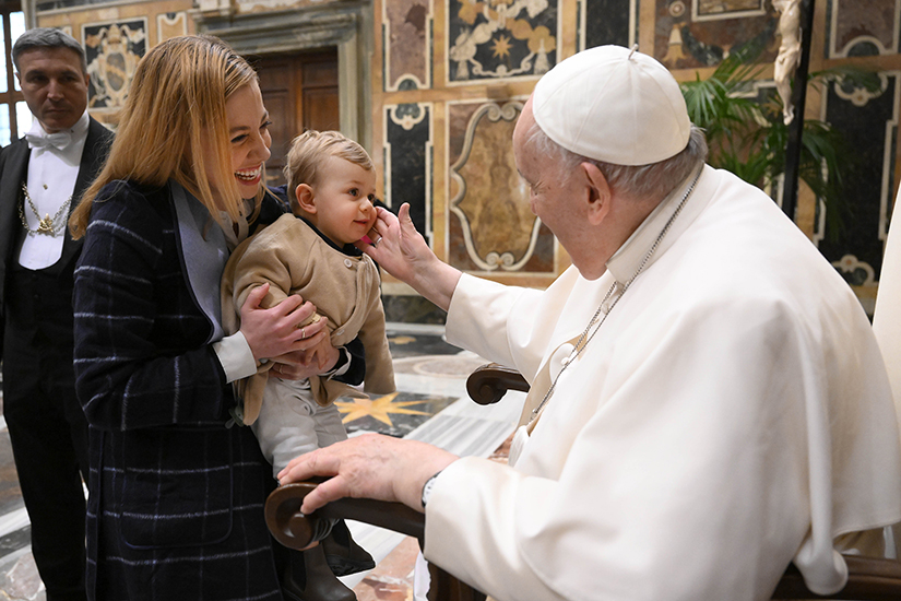 Pope Francis greeted Vatican News correspondent Deborah Castellano Lubov and her son after meeting the organizers of the study “More Women’s Leadership for a Better World” in an audience at the Vatican on March 11.
