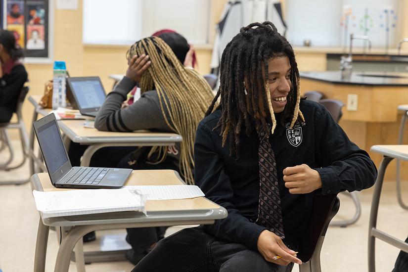 Cardinal Ritter College Prep senior Dijon Askew smiled during class March 16 at the high school in St. Louis. Askew is part of Movement Not Moment, an anti-gun violence effort at Cardinal Ritter College Prep that was started following the 2021 shooting death of Cardinal Ritter graduate Isis Mahr.