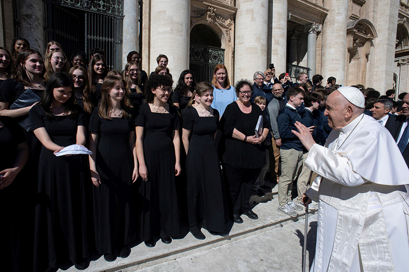 Pope Francis greeted members of the Rosati-Kain High School advanced chorus after his general audience March 15 at the Vatican. The Rosati-Kain chorus sang three songs for the pope, who also blessed teacher Maureen Polasek, who is undergoing cancer treatments. To the right of Rosati-Kain is a group of band students from St. Louis University High School.