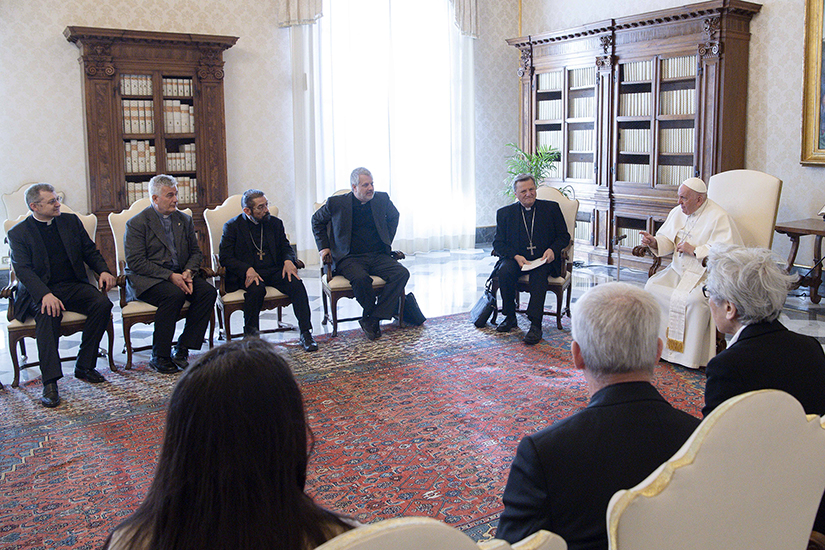 Pope Francis met with members of the preparatory commission for the general assembly of the Synod of Bishops in the library of the Apostolic Palace at the Vatican March 16. Pictured to the left of the pope are: Cardinal Mario Grech, secretary-general of the Synod; Jesuit Father Giacomo Costa, commission coordinator; Bishop Daniel E. Flores of Brownsville, Texas; Father Dario Vitali; and Msgr. Tomasz Trafny.