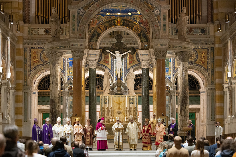 Clergy from Eastern and Roman rite Churches stood together during a Divine Liturgy for peace in Ukraine on March 22 at the Cathedral Basilica of Saint Louis. Archbishop Borys Gudziak, center at microphone, Metropolitan Archbishop of Philadelphia of the Ukrainian Greek Catholic Church, was the principal celebrant, and Archbishop Mitchell T. Rozanski, to left of Archbishop Gudziak) gave the homily.