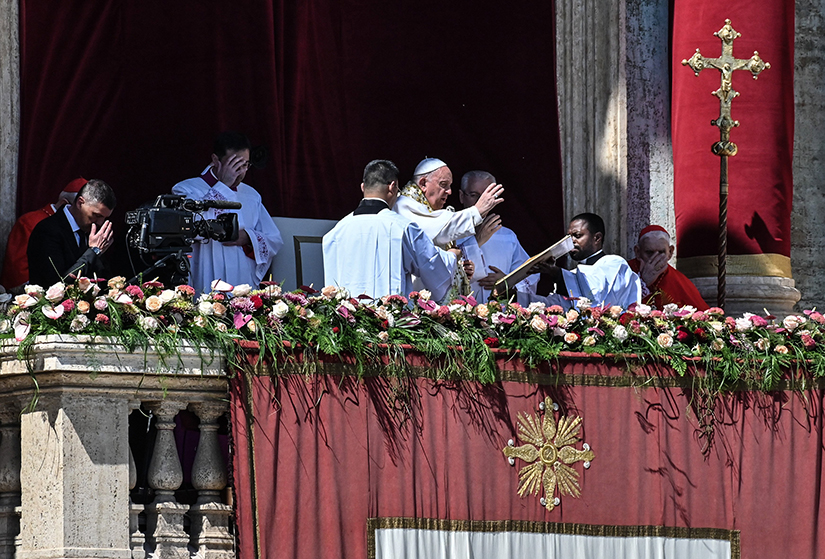 Pope Francis gave his blessing “urbi et orbi” (to the city and the world) from the central balcony of St. Peter’s Basilica at the Vatican after celebrating Easter morning Mass April 9.