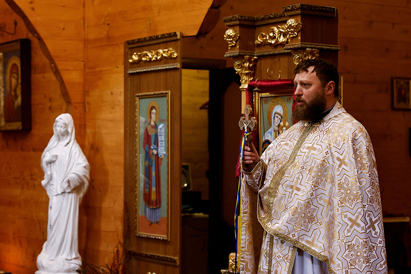 Father Serhii Palamarchuk of the Ukrainian Greek Catholic Church celebrated Mass at a church in Kostiantynivka March 19 with boarded windows to protect it from shelling.