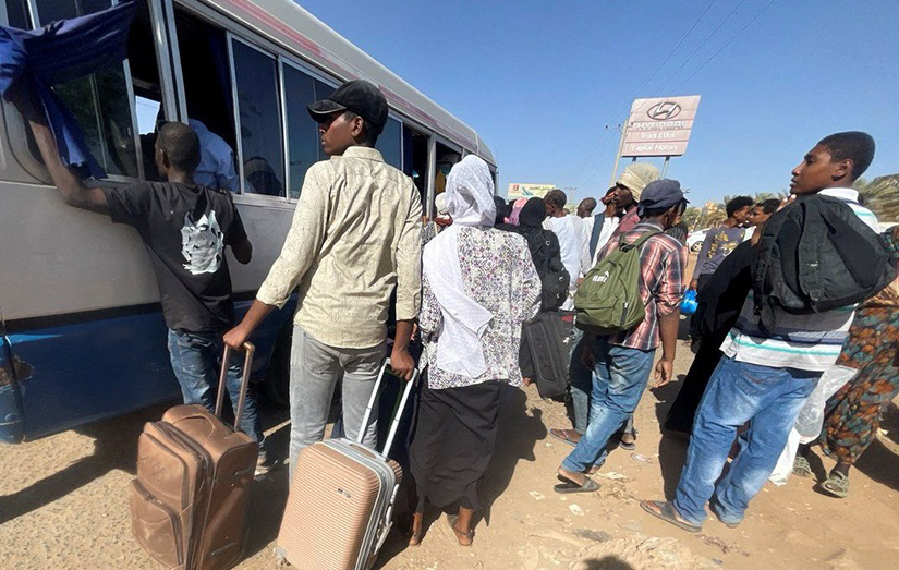 People fleeing clashes between the paramilitary Rapid Support Forces and the army gathered at the bus station in Khartoum, Sudan, April 19.