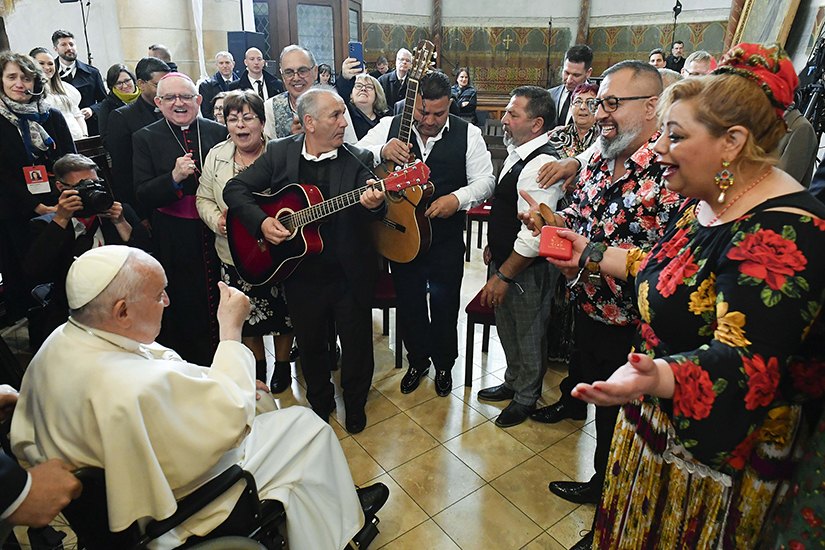Members of the Roma community in traditional dress performed a song for Pope Francis after a meeting with Roma, refugees, the poor and the many Catholics in Hungary who assist them in St. Elizabeth of Hungary Church in Budapest April 29.
