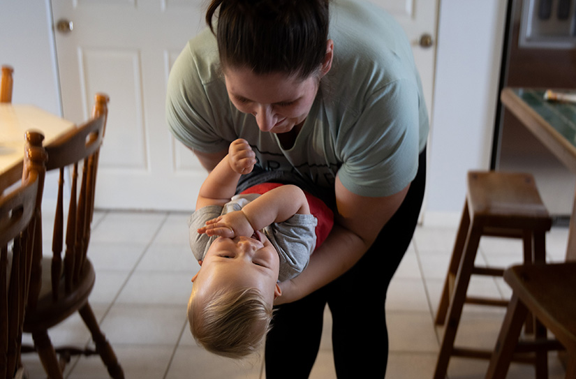 Sammi Sallee of St. Paul Parish in Fenton played with her 9-month-old son, Jaxon, June 5 at her home in Old Monroe. Sallee attended a retreat last year with Gabriel’s Retreat Ministries, where she received support during and after her pregnancy and experienced a revival in her faith.