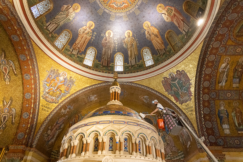 Rodrigo Canto of John Tiedemann Inc. cleaned marble and mosaics of the baldacchino June 20 in the sanctuary of the Cathedral Basilica of Saint Louis.
