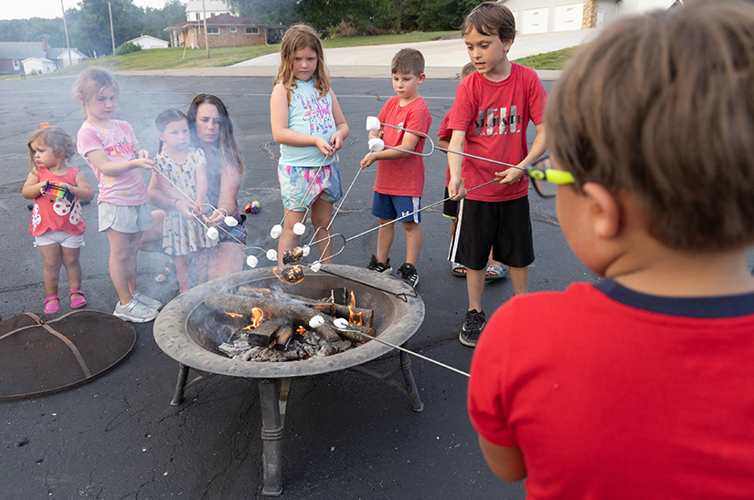 Children roasted marshmallows on the eve of the Nativity of St. John the Baptist June 23 at St. Joseph Parish in Zell. The event incorporated liturgical elements like the Liturgy of the Hours with time for fellowship and fun.
