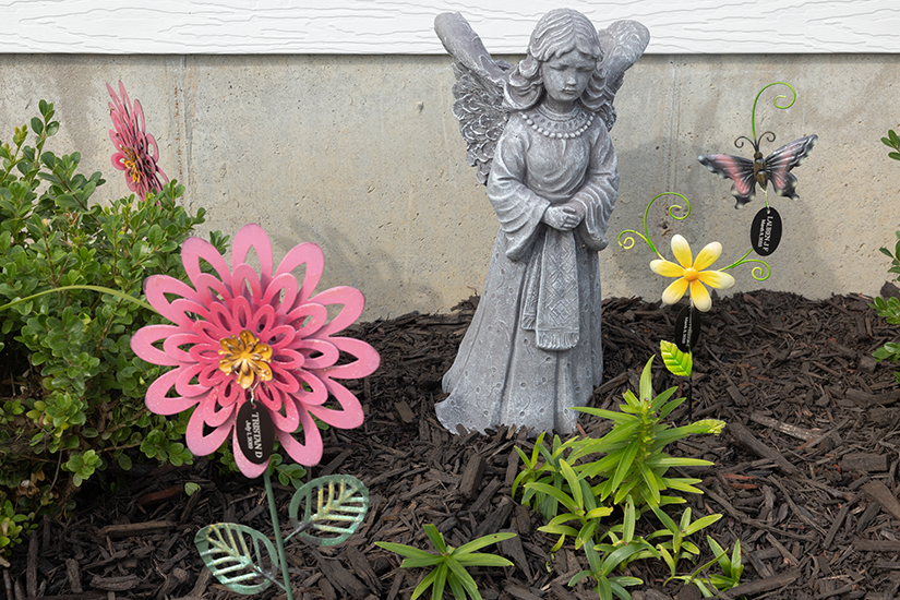 Garden ornaments at Saint Martha’s Drop-In Center in south St. Louis County featured the names of victims killed in domestic violence incidents. The drop-in center provides help to women and children impacted by domestic violence, plus resources for their families and friends.
