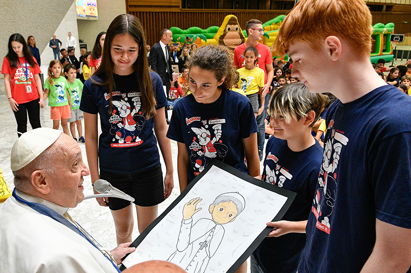 Children of Vatican employees attending a summer camp gave a drawing to Pope Francis as he visited them in the Vatican’s Paul VI audience hall July 18.