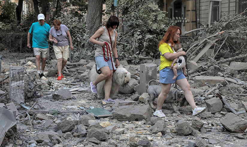 Residents walked across debris following a Russian missile strike in Odesa, Ukraine, July 23.