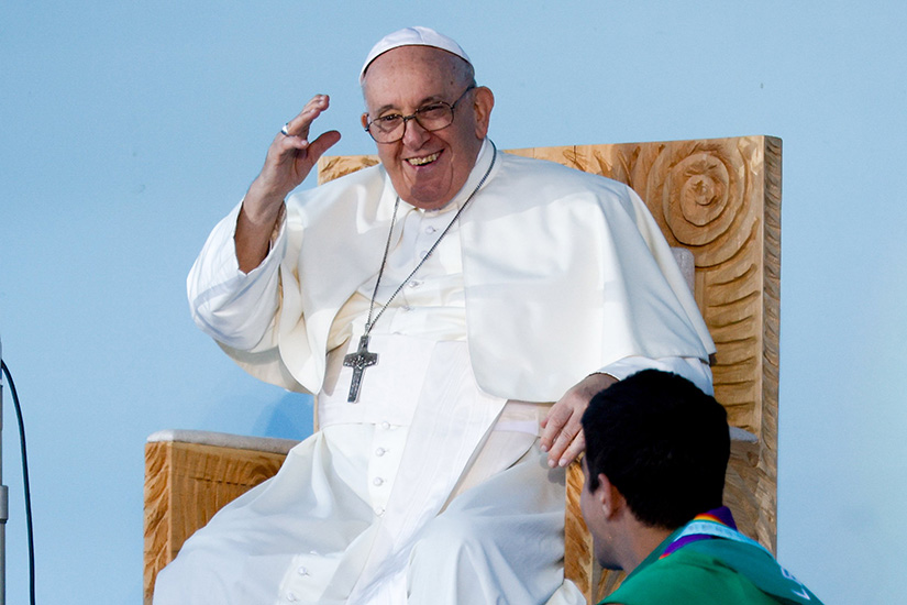 Pope Francis smiled and waved to young people during the World Youth Day welcome ceremony at Eduardo VII Park in Lisbon, Portugal, Aug. 3.